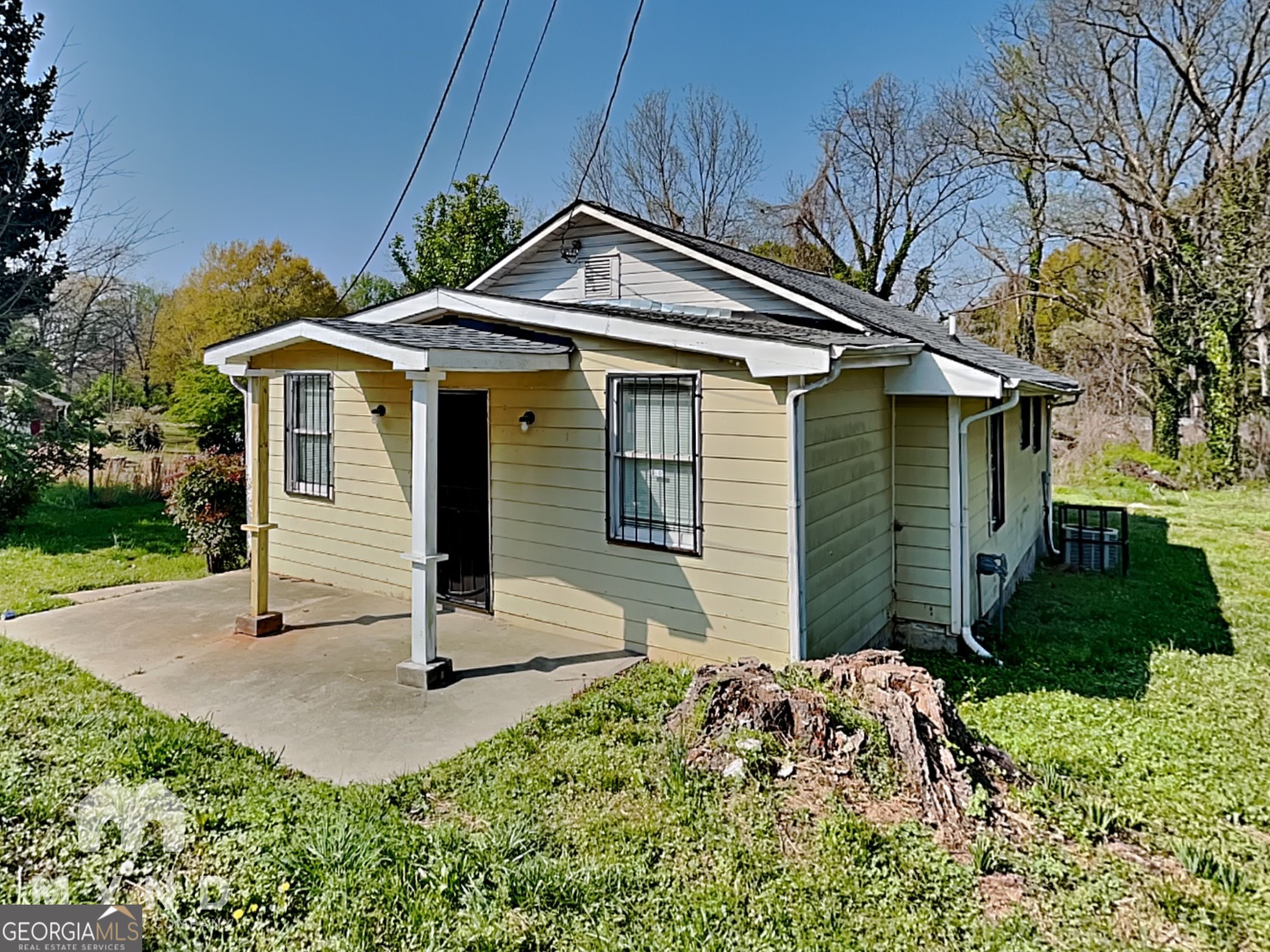 1337 South Hairston Road Stone Mountain, GA 30088 - Photo 1 of 17 a front view of a house with a yard