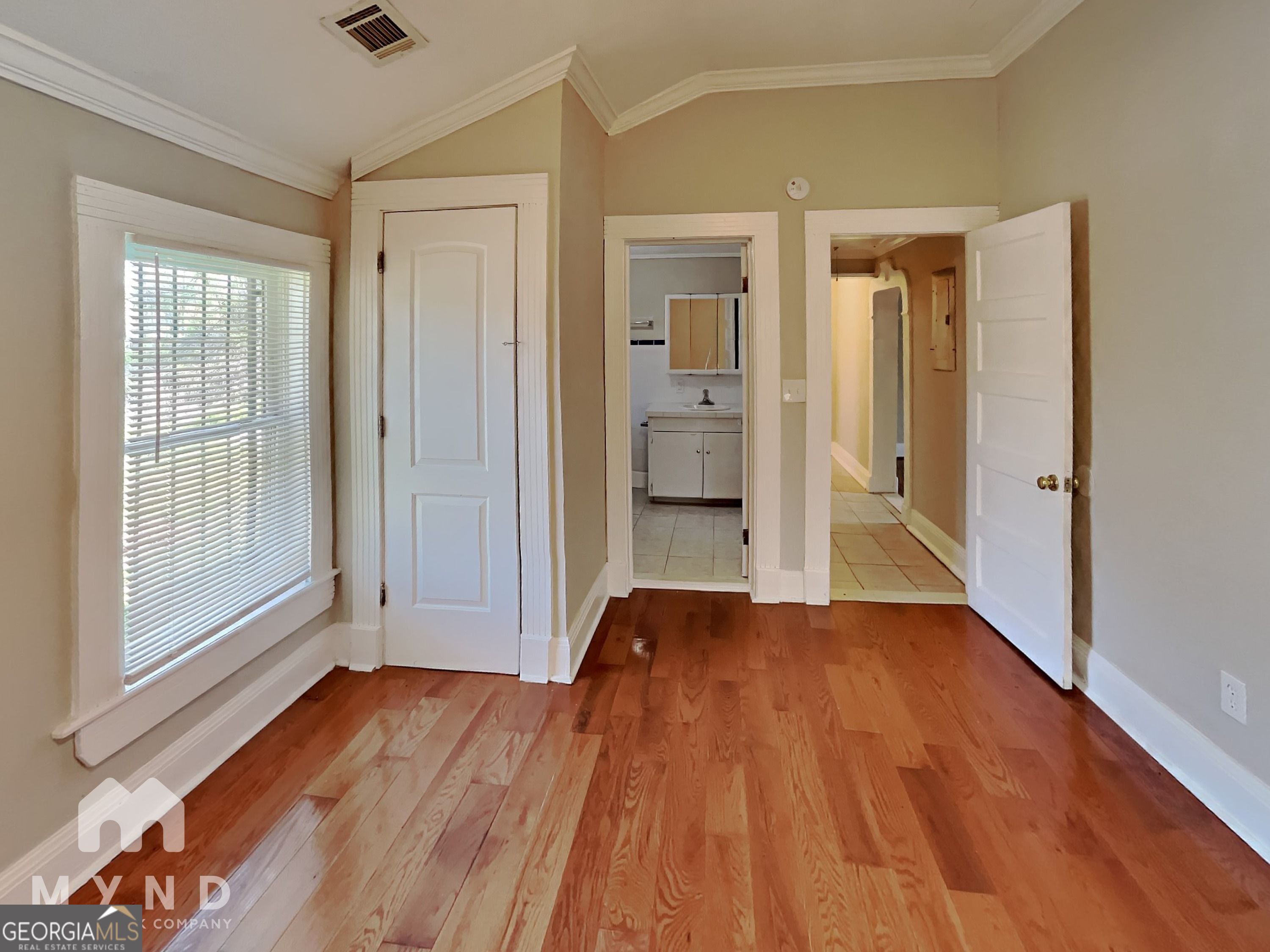 1337 South Hairston Road Stone Mountain, GA 30088 - Photo 11 of 17 a view of a room with wooden floor and bathroom