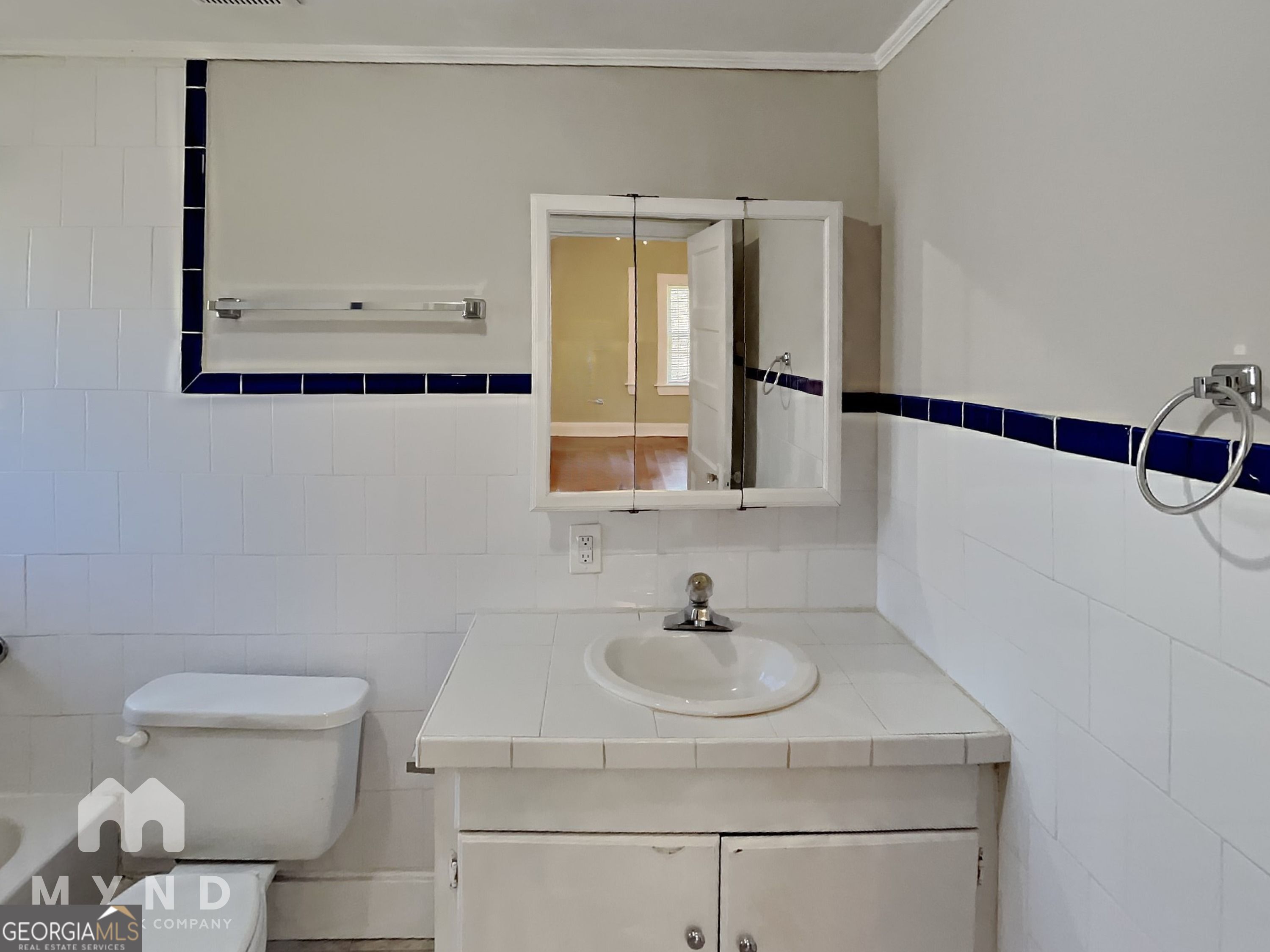 1337 South Hairston Road Stone Mountain, GA 30088 - Photo 12 of 17 a bathroom with a sink and a toilet