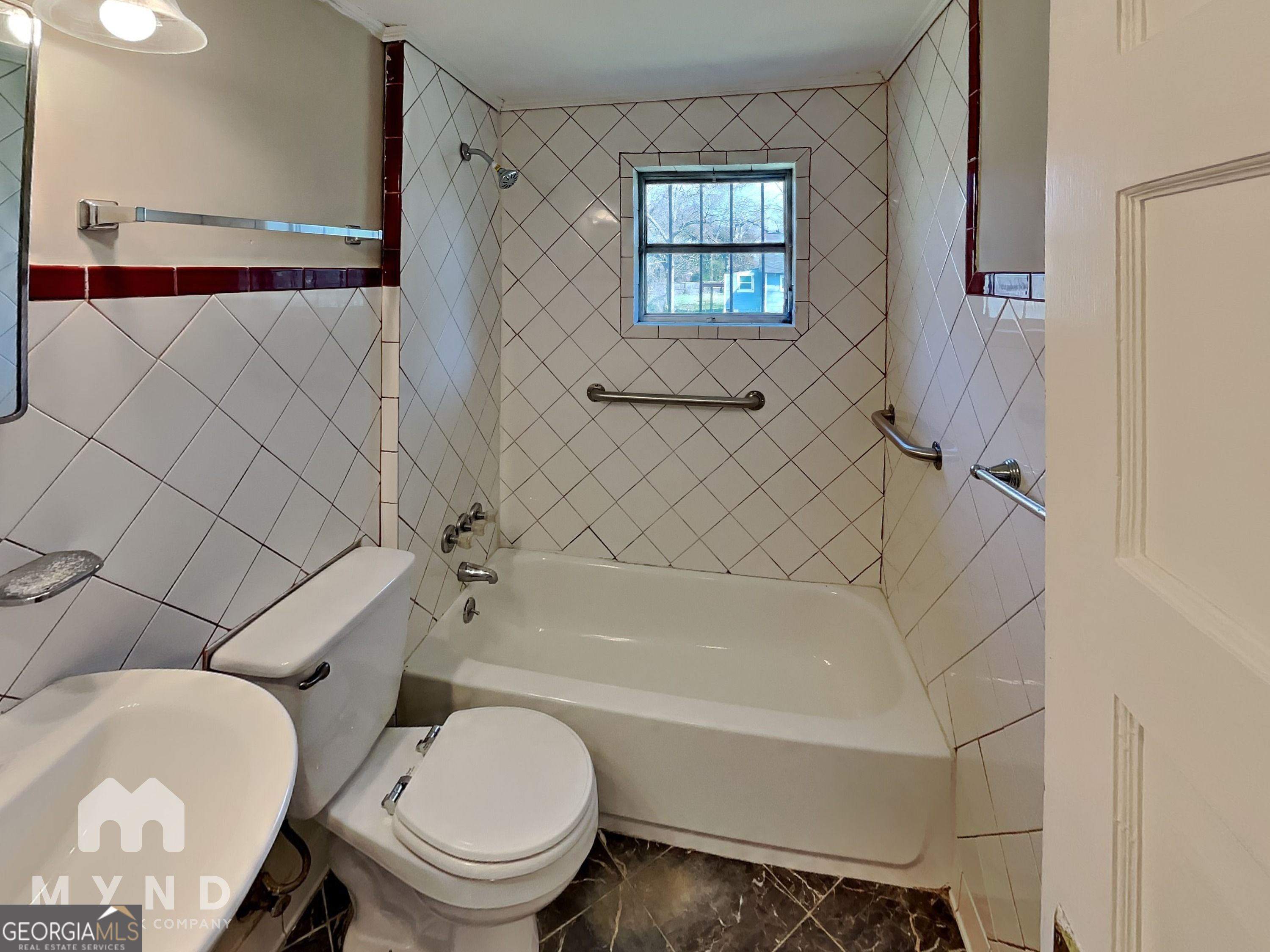 1337 South Hairston Road Stone Mountain, GA 30088 - Photo 16 of 17 a bathroom with a toilet and a bathtub