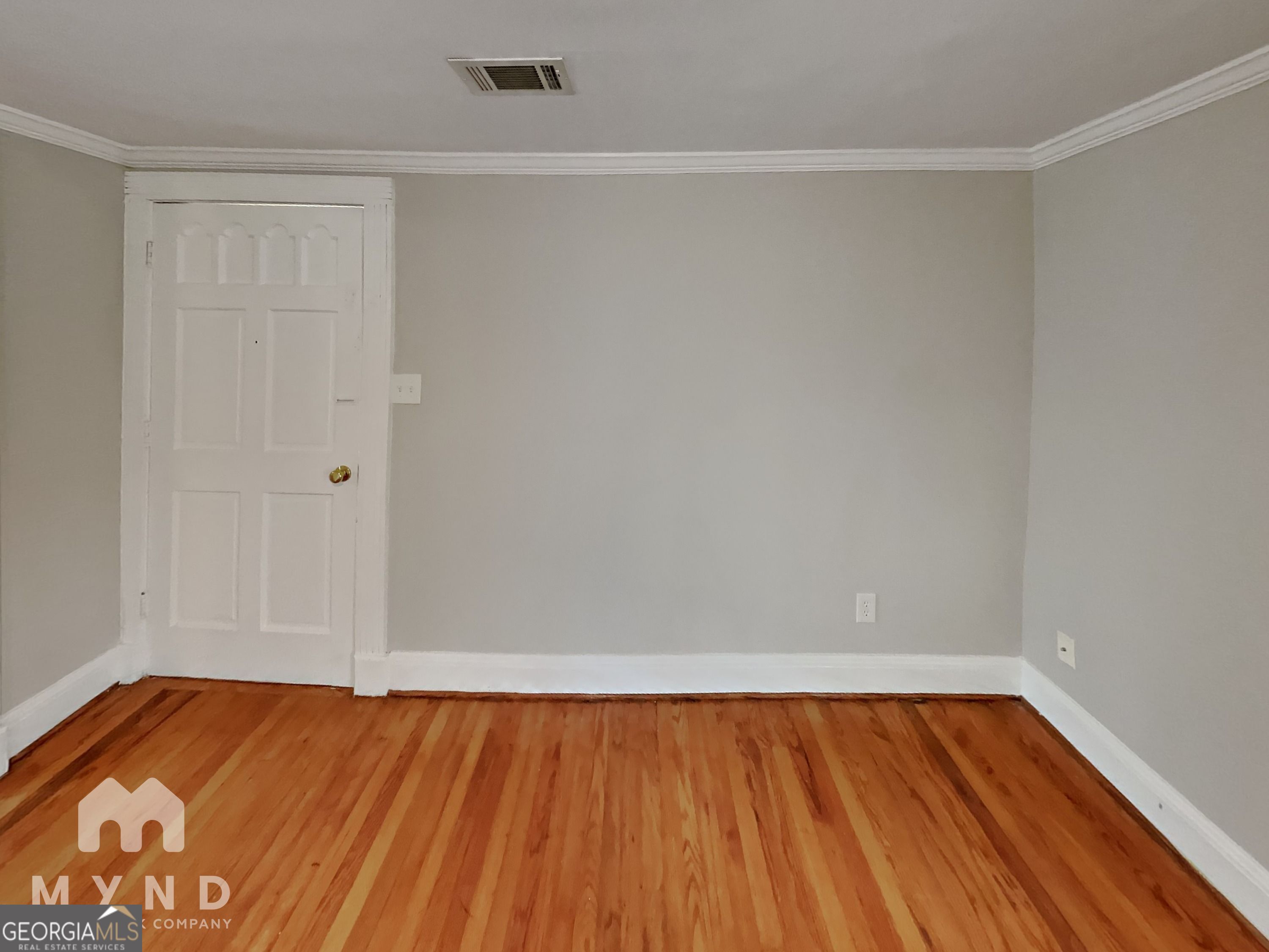 1337 South Hairston Road Stone Mountain, GA 30088 - Photo 6 of 17 a view of room with window and wooden floor