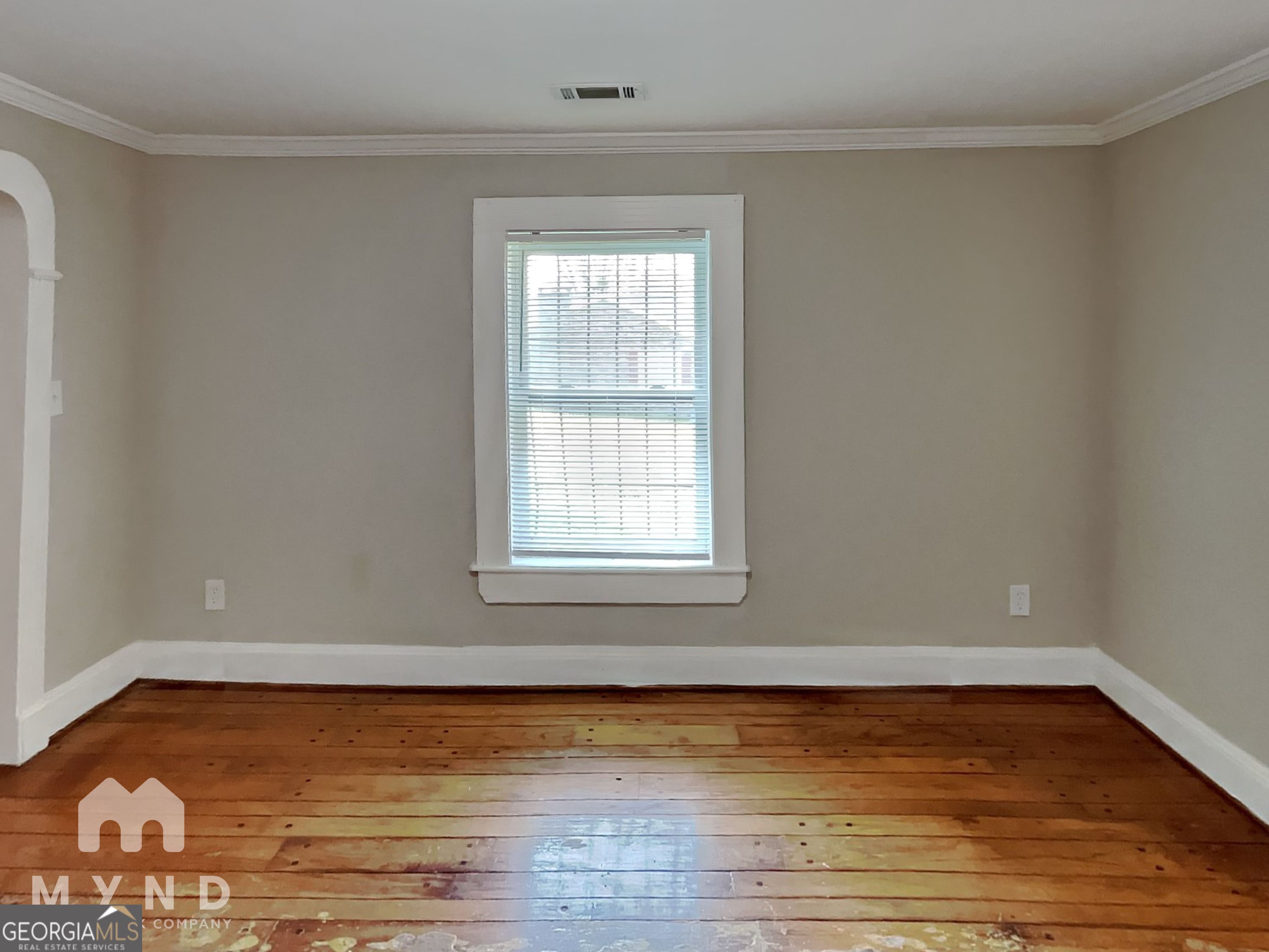 1337 South Hairston Road Stone Mountain, GA 30088 - Photo 7 of 17 a view of a room with wooden floor and window