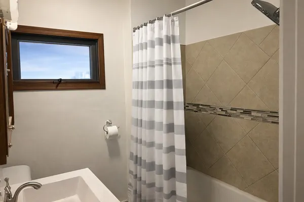 a bathroom with a shower curtain