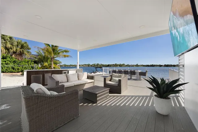 a view of a lake with outdoor seating