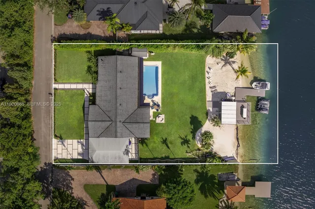 an aerial view of a house with a lake view