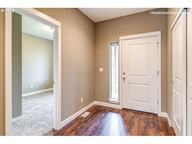 1060 6th Street Gervais, OR 97026 - Photo 12 of 30 view of an empty room with wooden floor