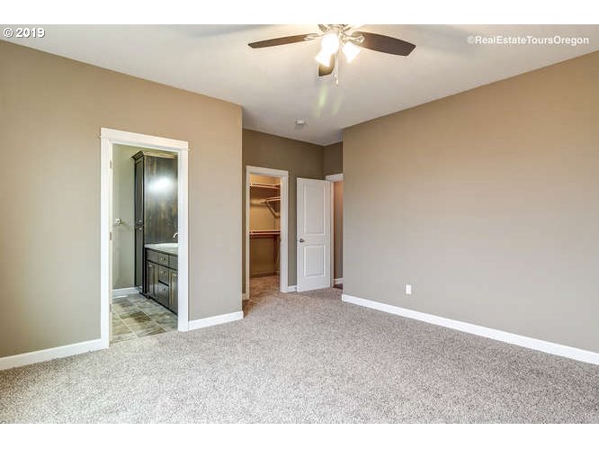 1060 6th Street Gervais, OR 97026 - Photo 22 of 30 a view of an empty room and chandelier fan