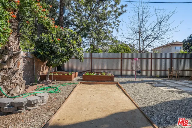 a backyard of a house with outdoor seating