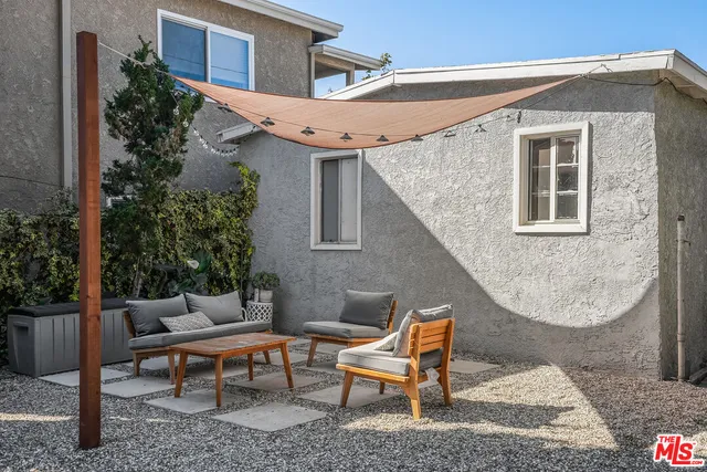 a view of a backyard with a patio