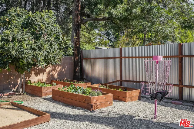a backyard of a house with outdoor seating