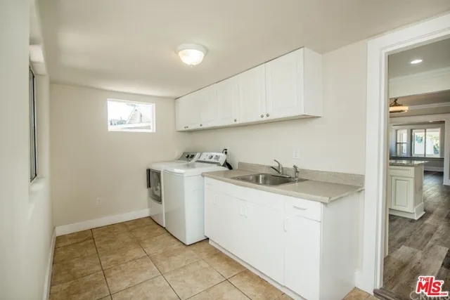 a view of a room with a sink and closet