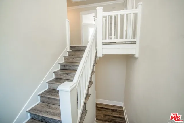 a view of hallway with wooden floor