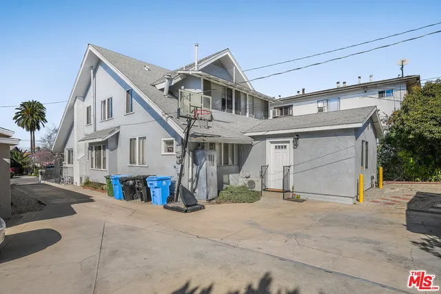 a view of a backyard with a table and chairs