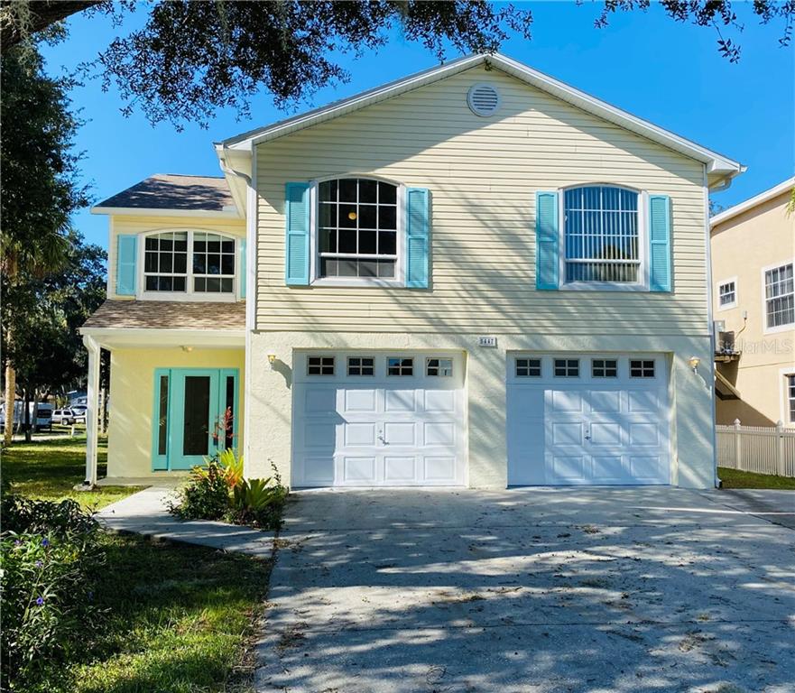 5447 Tropic Drive New Port Richey, FL 34653 - Photo 1 of 1 a front view of a house with garden