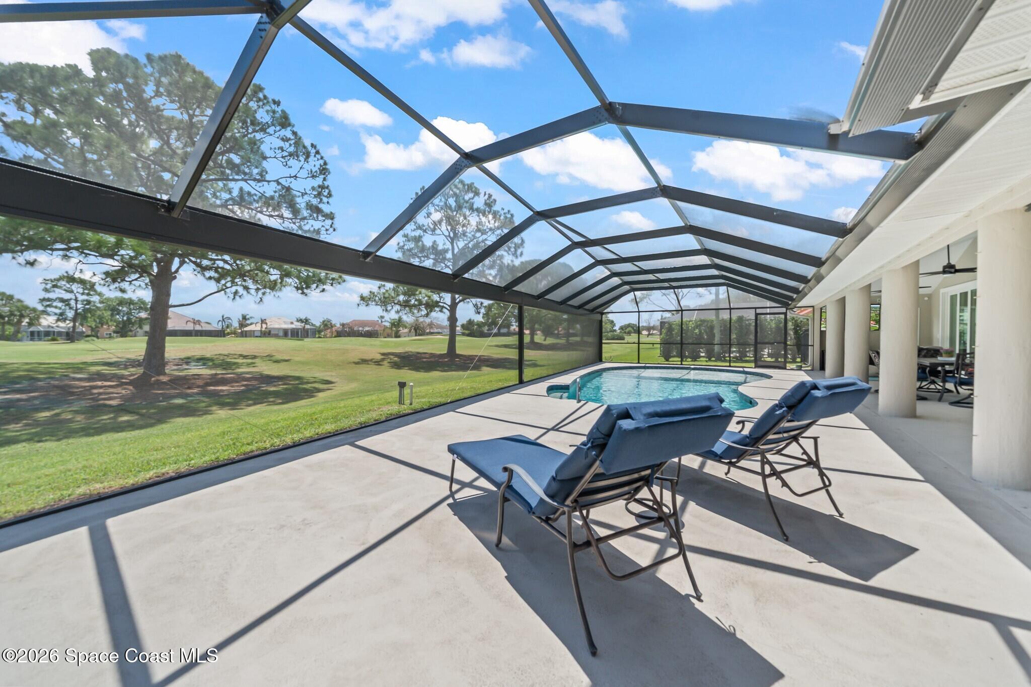 697 Spring Lake Drive Melbourne, FL 32940 - Photo 29 of 45 a view of a patio with a backyard