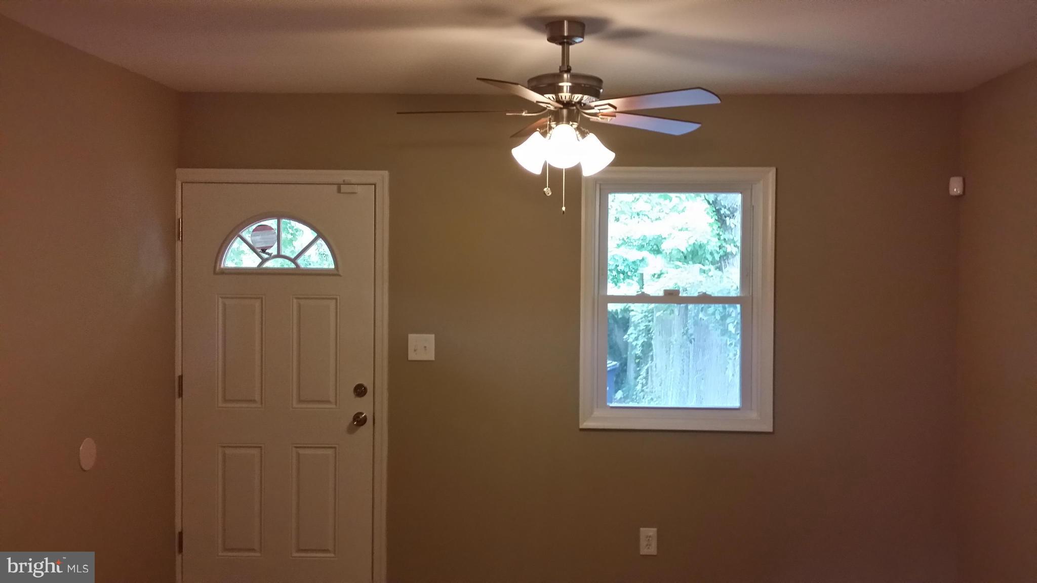 7634 Muncy Road Hyattsville, MD 20785 - Photo 5 of 21 a view of a chandelier fan and livingroom