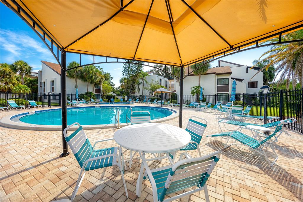 2207 Belleair Road, Unit B4 Clearwater, FL 33764 - Photo 29 of 37 a view of outdoor space yard deck patio and outdoor kitchen