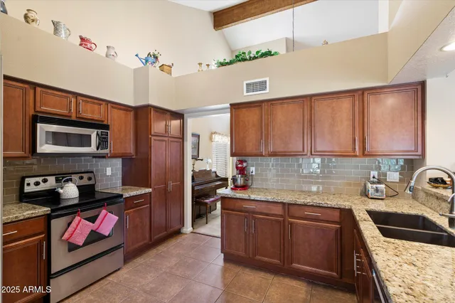 a kitchen with a sink stove and refrigerator