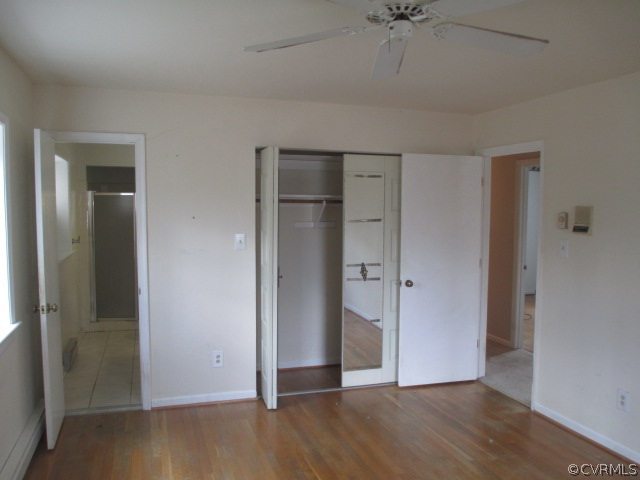 1201 Black Heath Road Midlothian, VA 23113 - Photo 13 of 17 an empty room with a ceiling fan and wooden floor