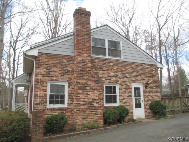 1201 Black Heath Road Midlothian, VA 23113 - Photo 2 of 17 a front view of a house with a yard and garage