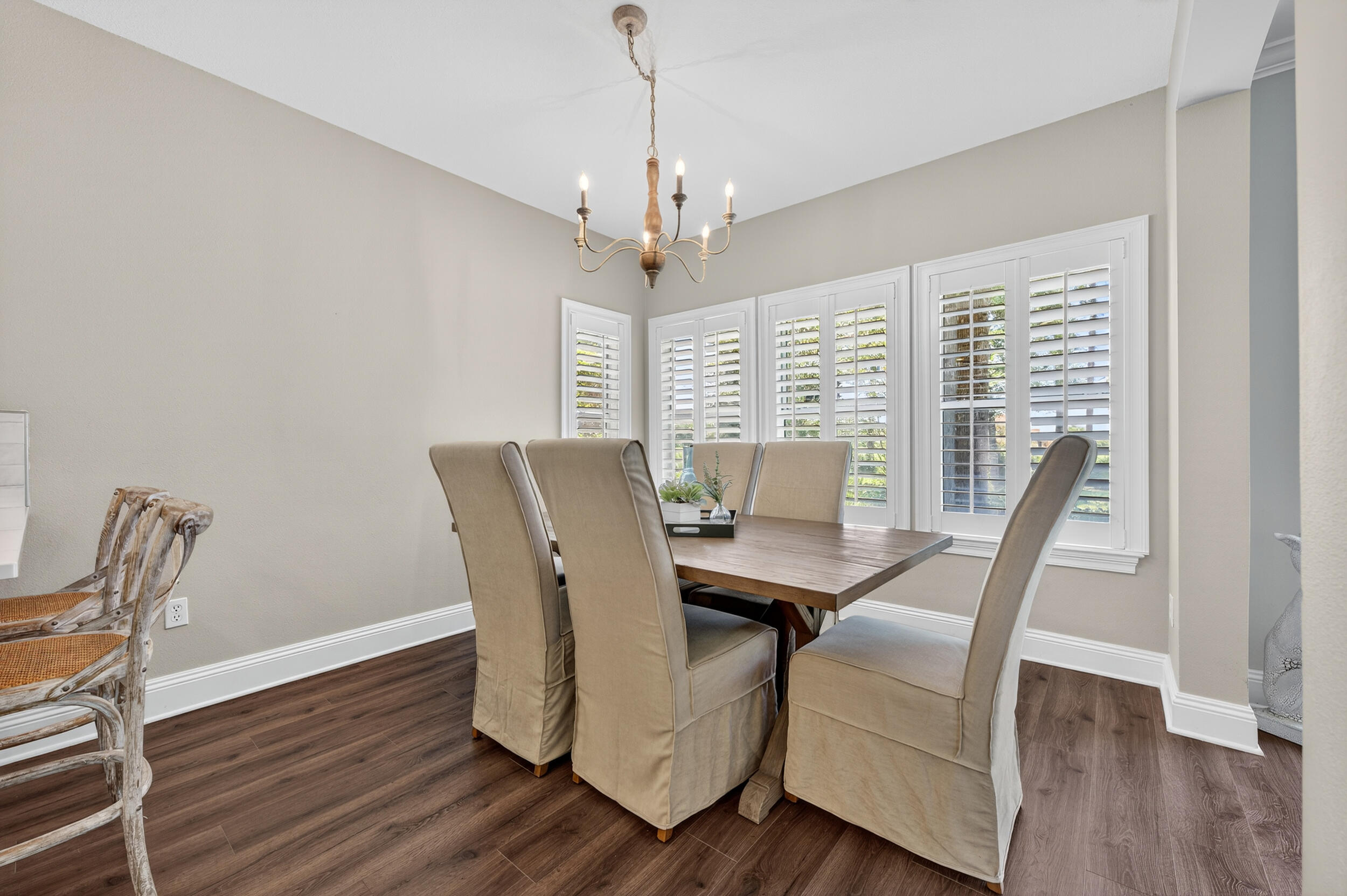 298 Ketch Court Destin, FL 32541 - Photo 16 of 79 a view of a dining room with furniture window and wooden floor