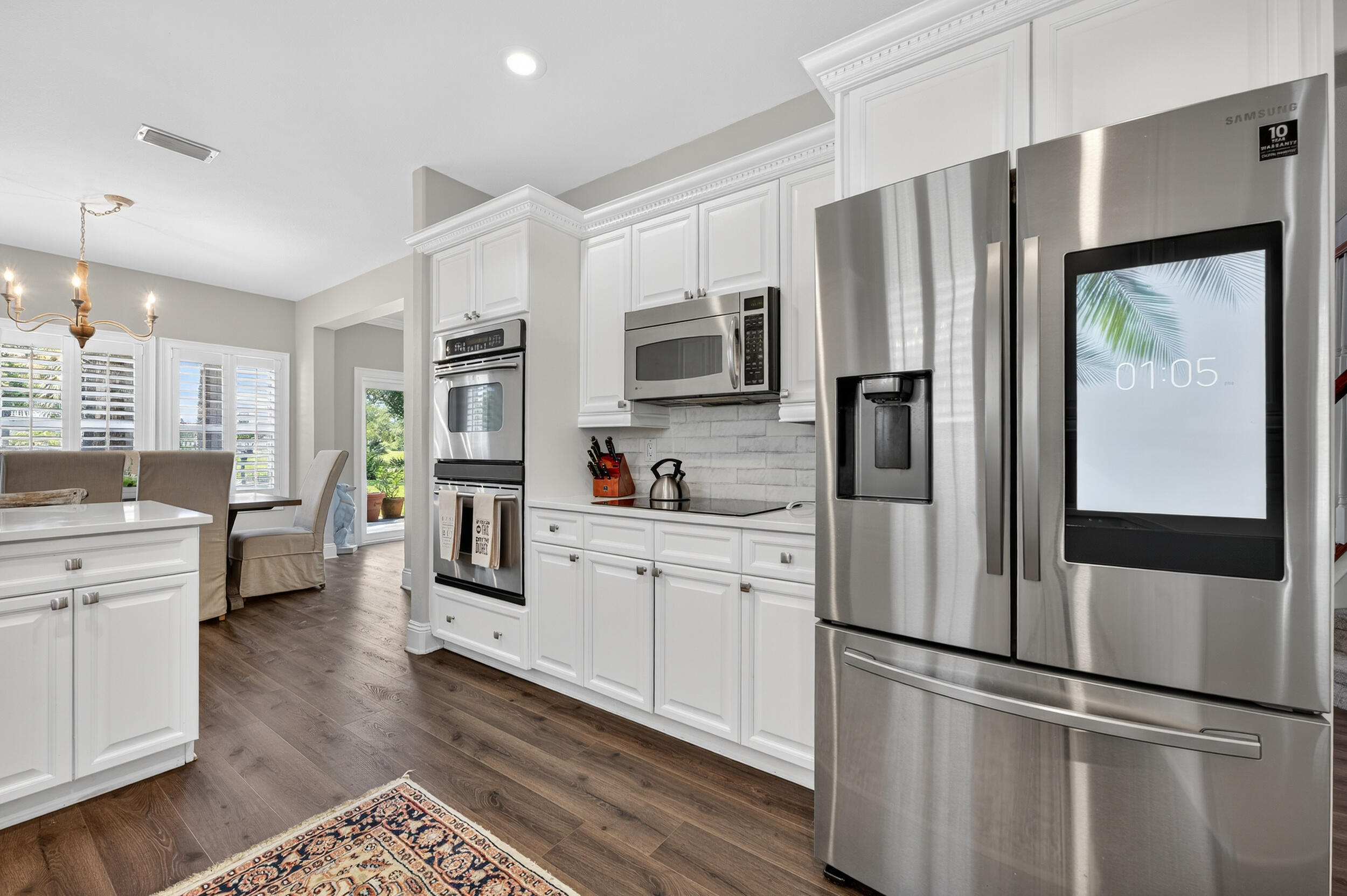 298 Ketch Court Destin, FL 32541 - Photo 21 of 79 a kitchen with stainless steel appliances a refrigerator sink and microwave