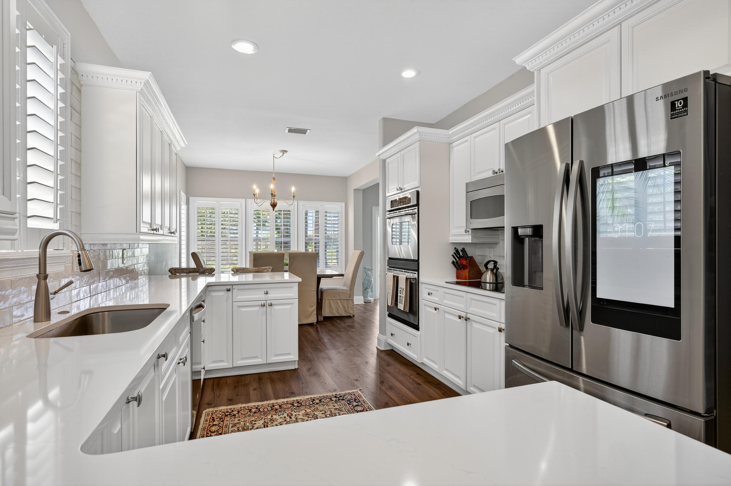 298 Ketch Court Destin, FL 32541 - Photo 24 of 79 a large kitchen with a large window and stainless steel appliances