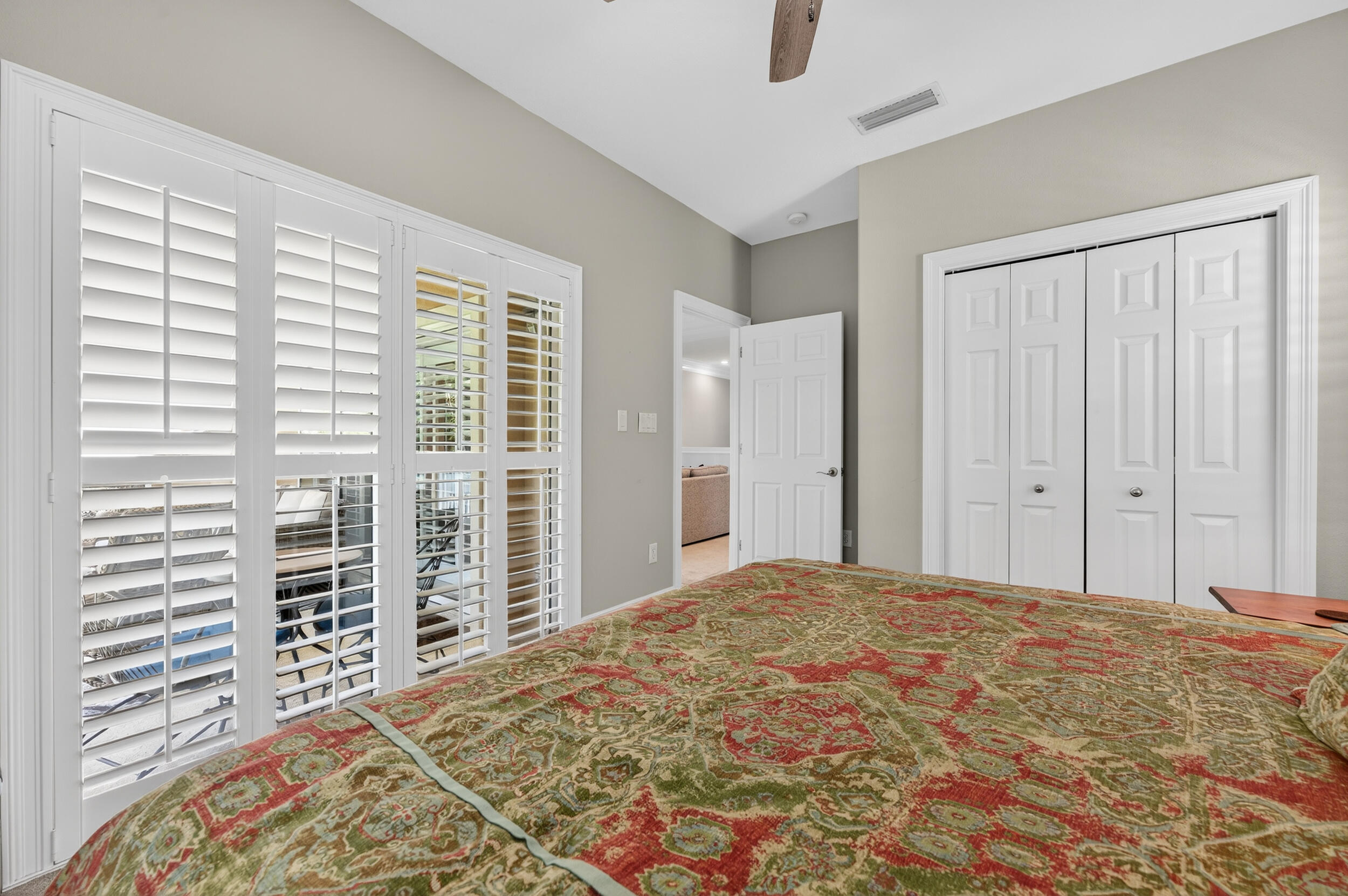 298 Ketch Court Destin, FL 32541 - Photo 55 of 79 a bedroom with a large bed and a chandelier