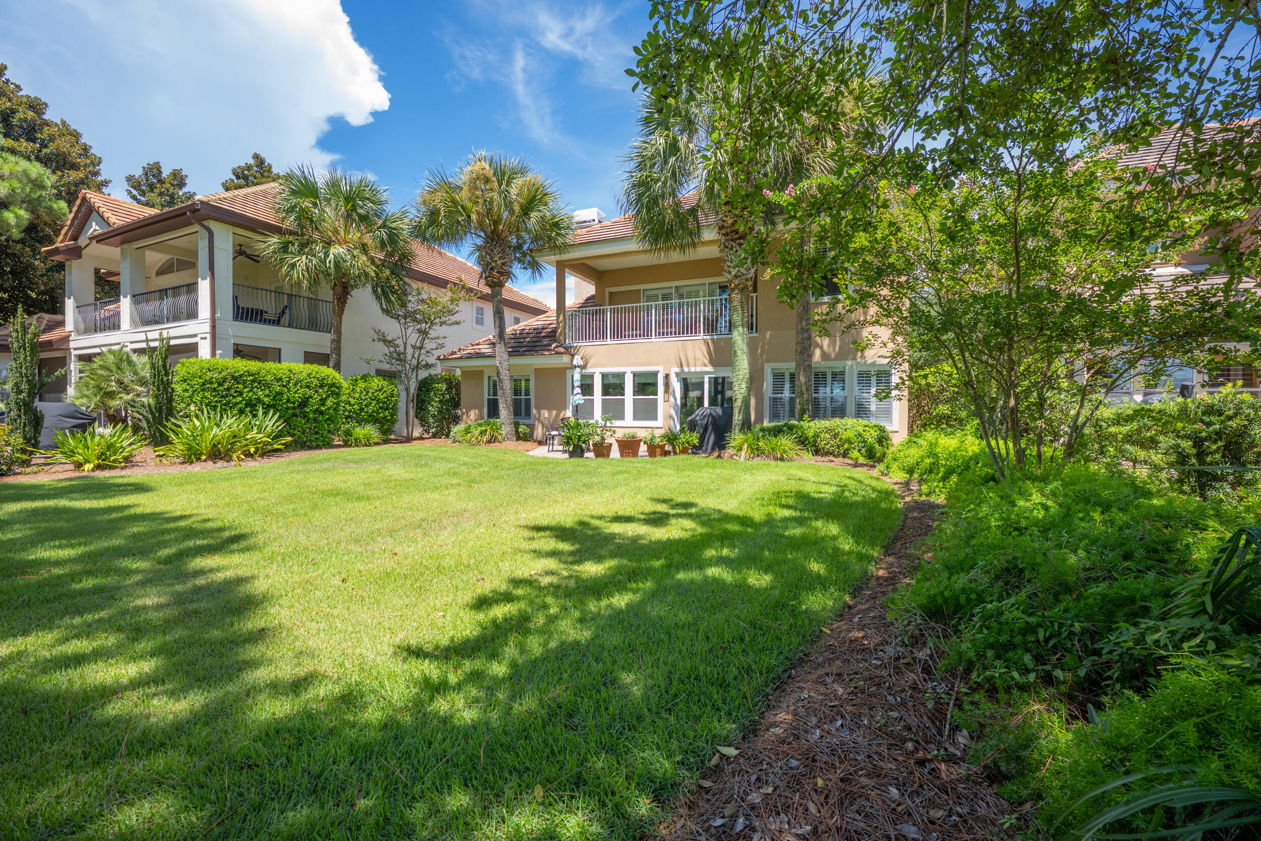 298 Ketch Court Destin, FL 32541 - Photo 64 of 79 a view of a big yard with plants and large trees