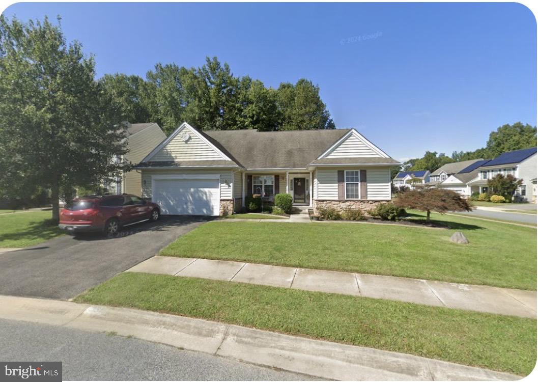231 Foxglove Loop Bear, DE 19701 - Photo 1 of 30 a front view of a house with a garden