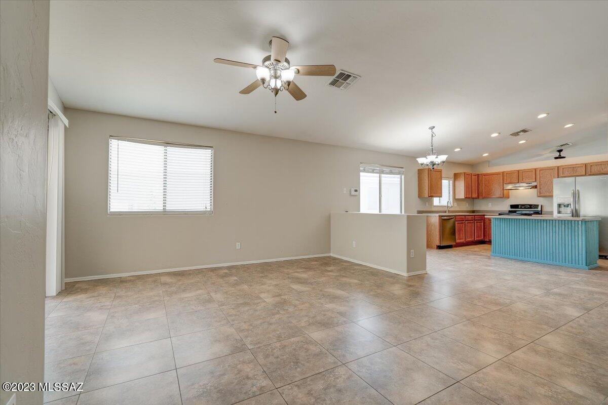 4686 South Valley Road Tucson, AZ 85714 - Photo 14 of 37 a view of a kitchen with a sink and cabinets