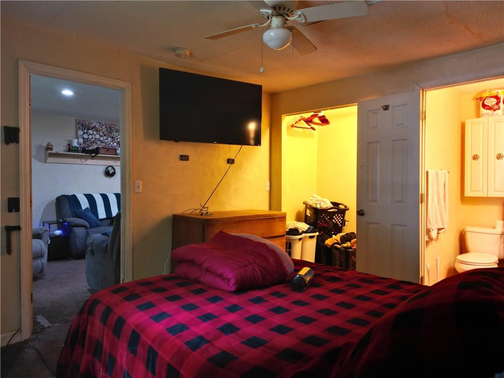 1119 Layton Road Butler, PA 16001 - Photo 11 of 25 a bedroom with a bed and a flat tv screen on dresser