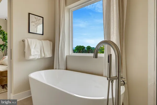 a bathroom with a shower sink vanity mirror and toilet