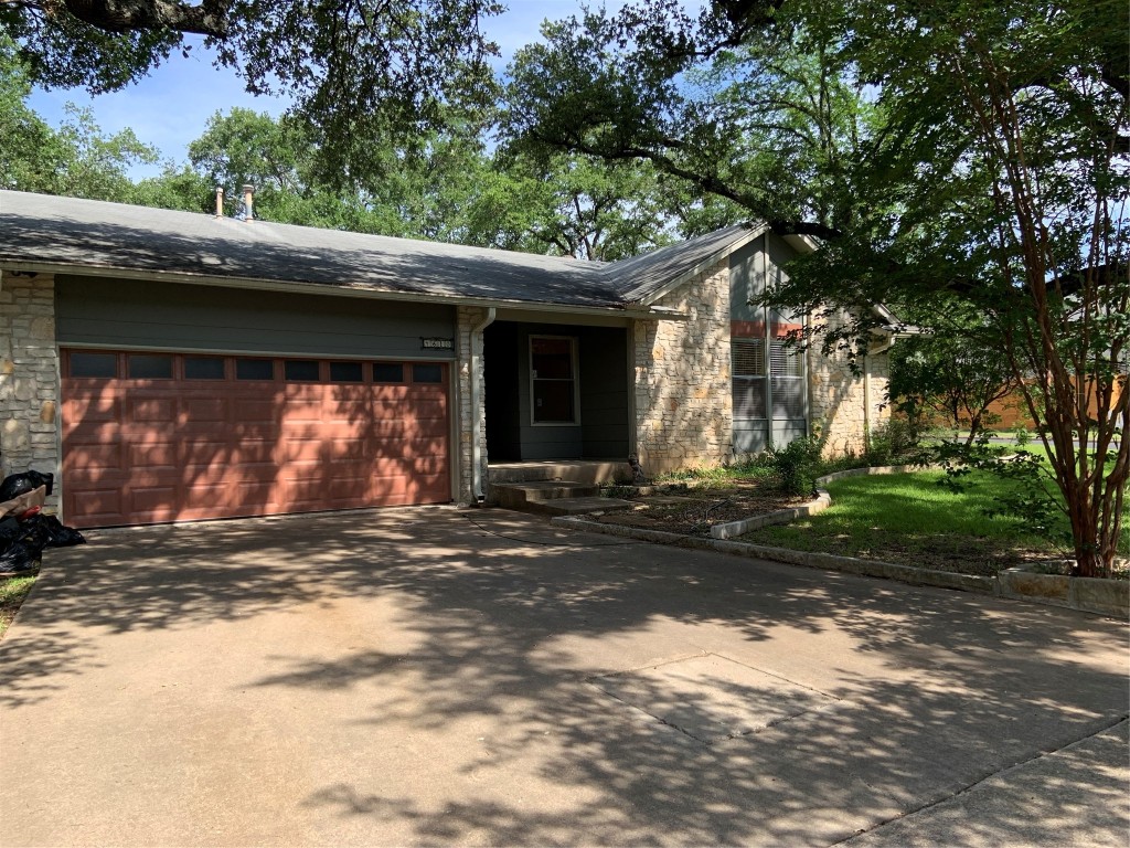 a view of a house with a tree