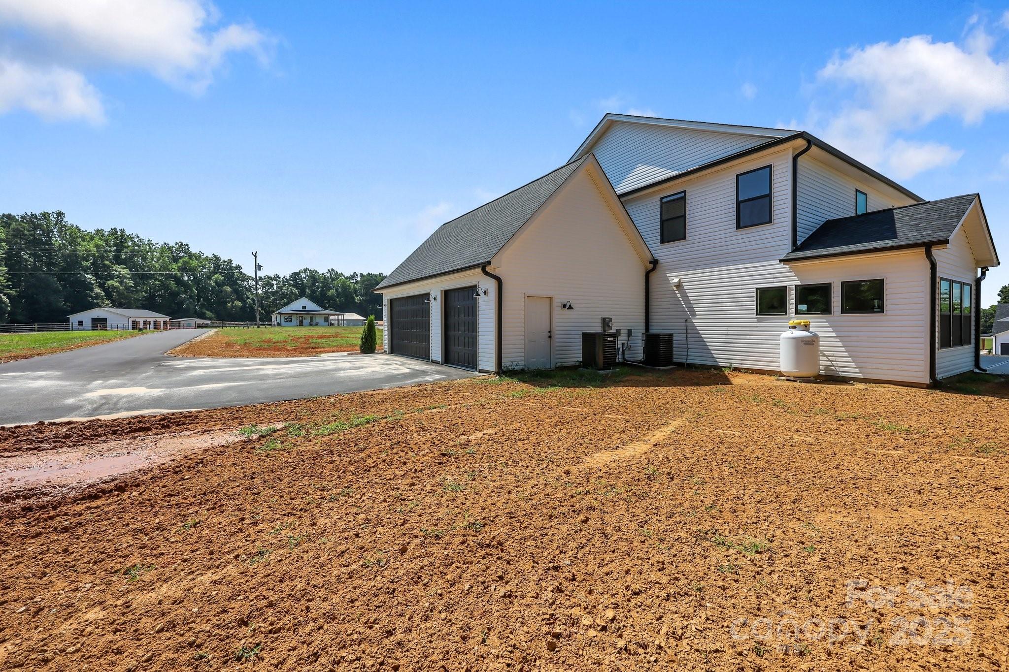 4040 Daugherty Road China Grove, NC 28023 - Photo 14 of 45 a front view of a house with a yard