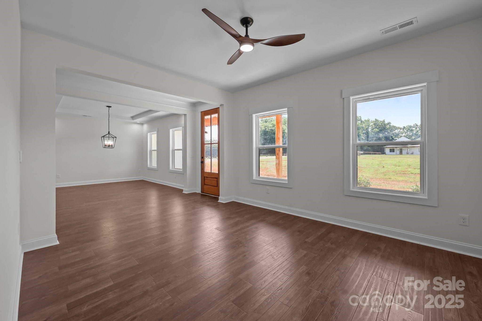4040 Daugherty Road China Grove, NC 28023 - Photo 16 of 45 a view of an empty room with wooden floor and a window