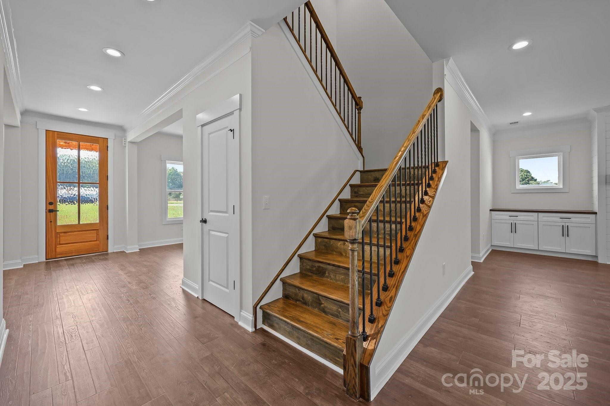 4040 Daugherty Road China Grove, NC 28023 - Photo 19 of 45 an entryway in a hall with wooden floor and stairs