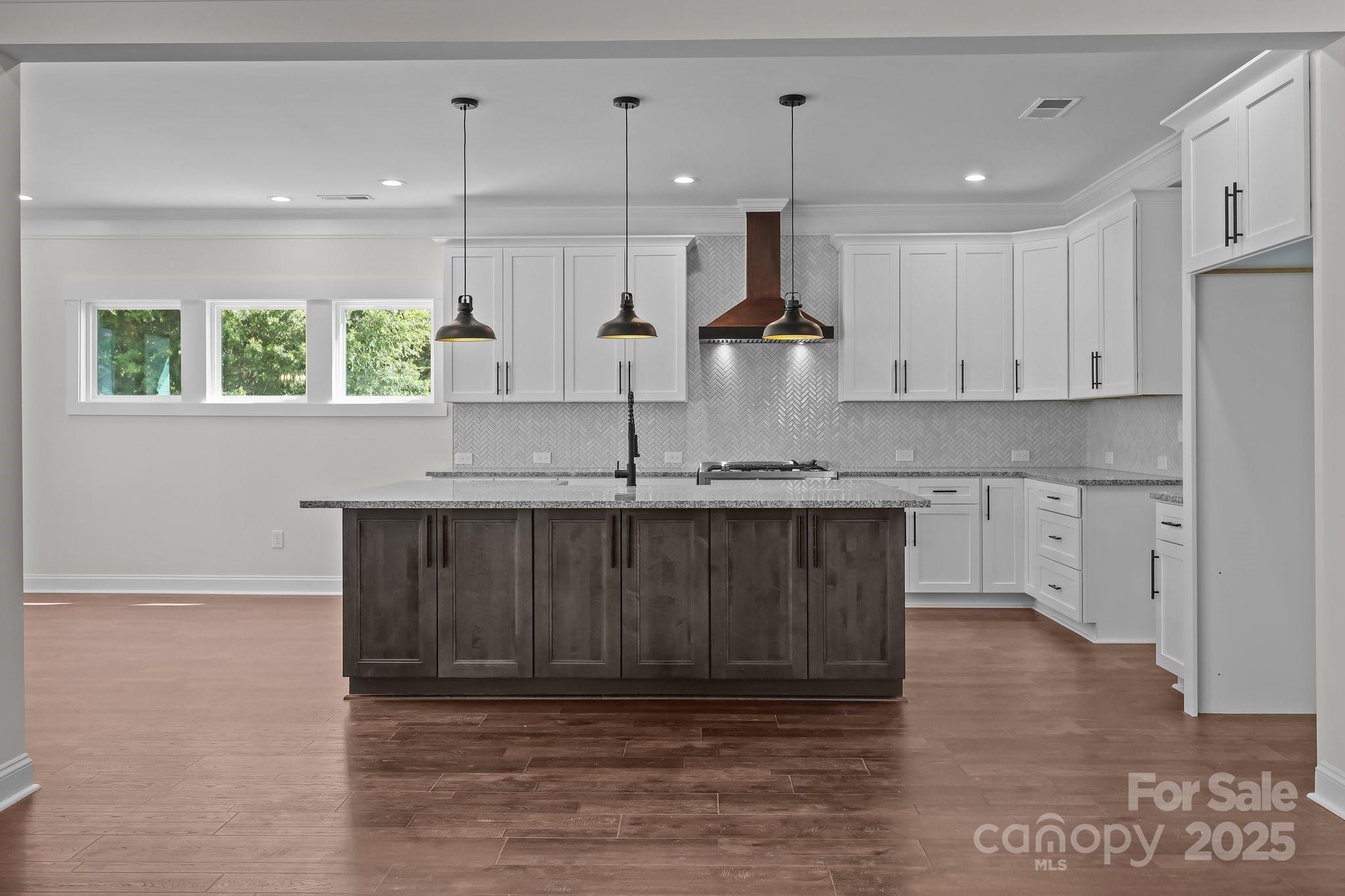 4040 Daugherty Road China Grove, NC 28023 - Photo 22 of 45 a kitchen with stainless steel appliances granite countertop a sink wooden cabinets and a granite counter top