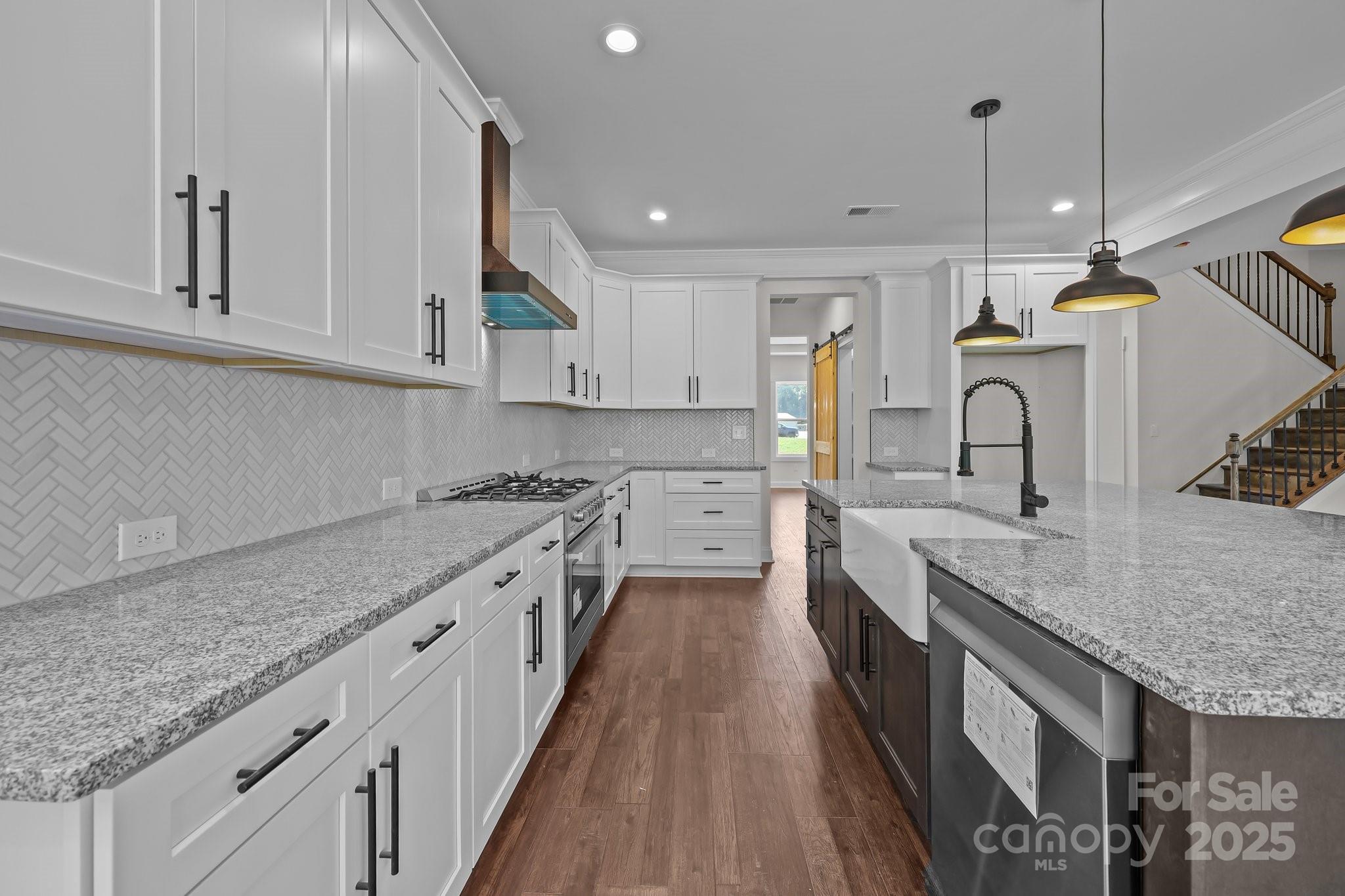 4040 Daugherty Road China Grove, NC 28023 - Photo 24 of 45 a kitchen with granite countertop a sink stove and cabinets