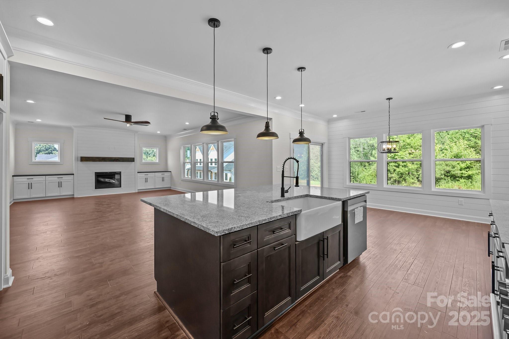 4040 Daugherty Road China Grove, NC 28023 - Photo 26 of 45 a large kitchen with kitchen island a large island in the center and a stove