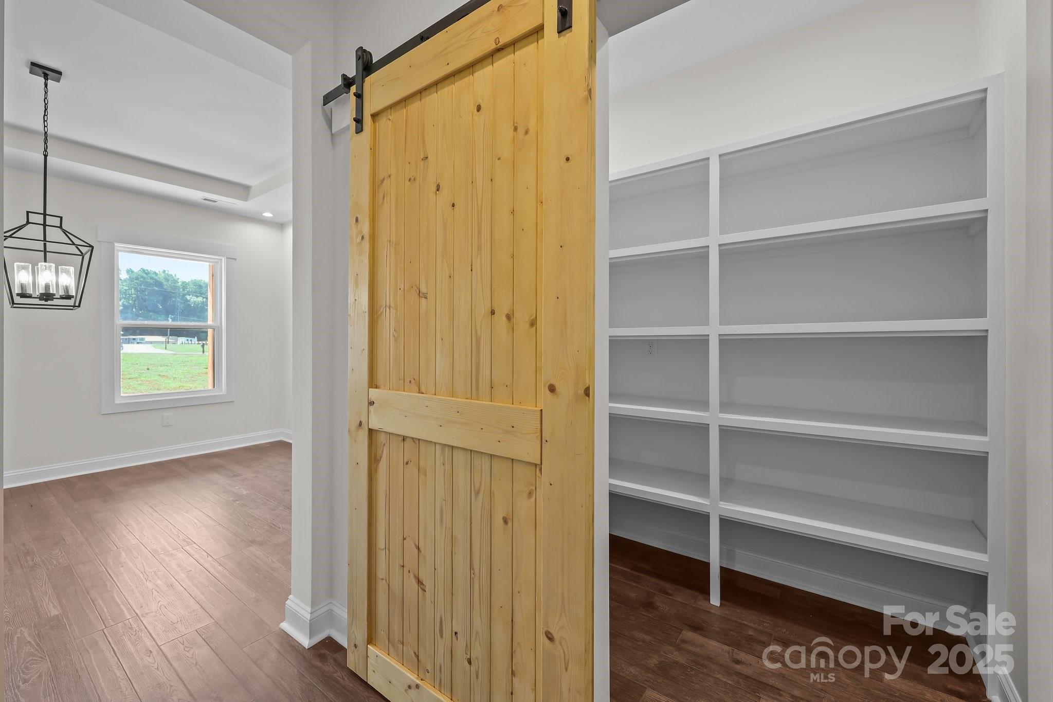 4040 Daugherty Road China Grove, NC 28023 - Photo 30 of 45 a view of walk in closet with empty racks
