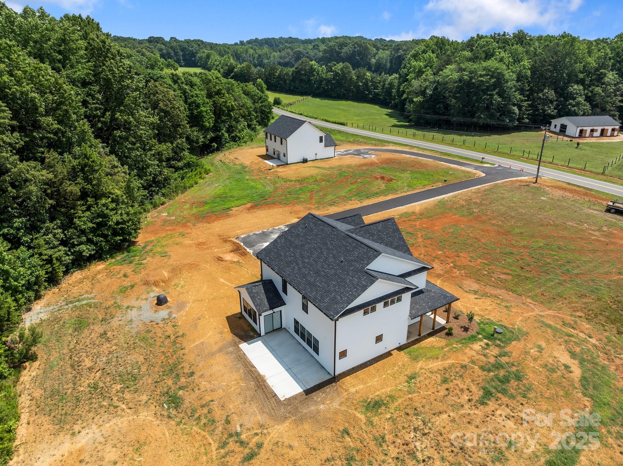 4040 Daugherty Road China Grove, NC 28023 - Photo 3 of 45 a view of a swimming pool with a yard and large tree