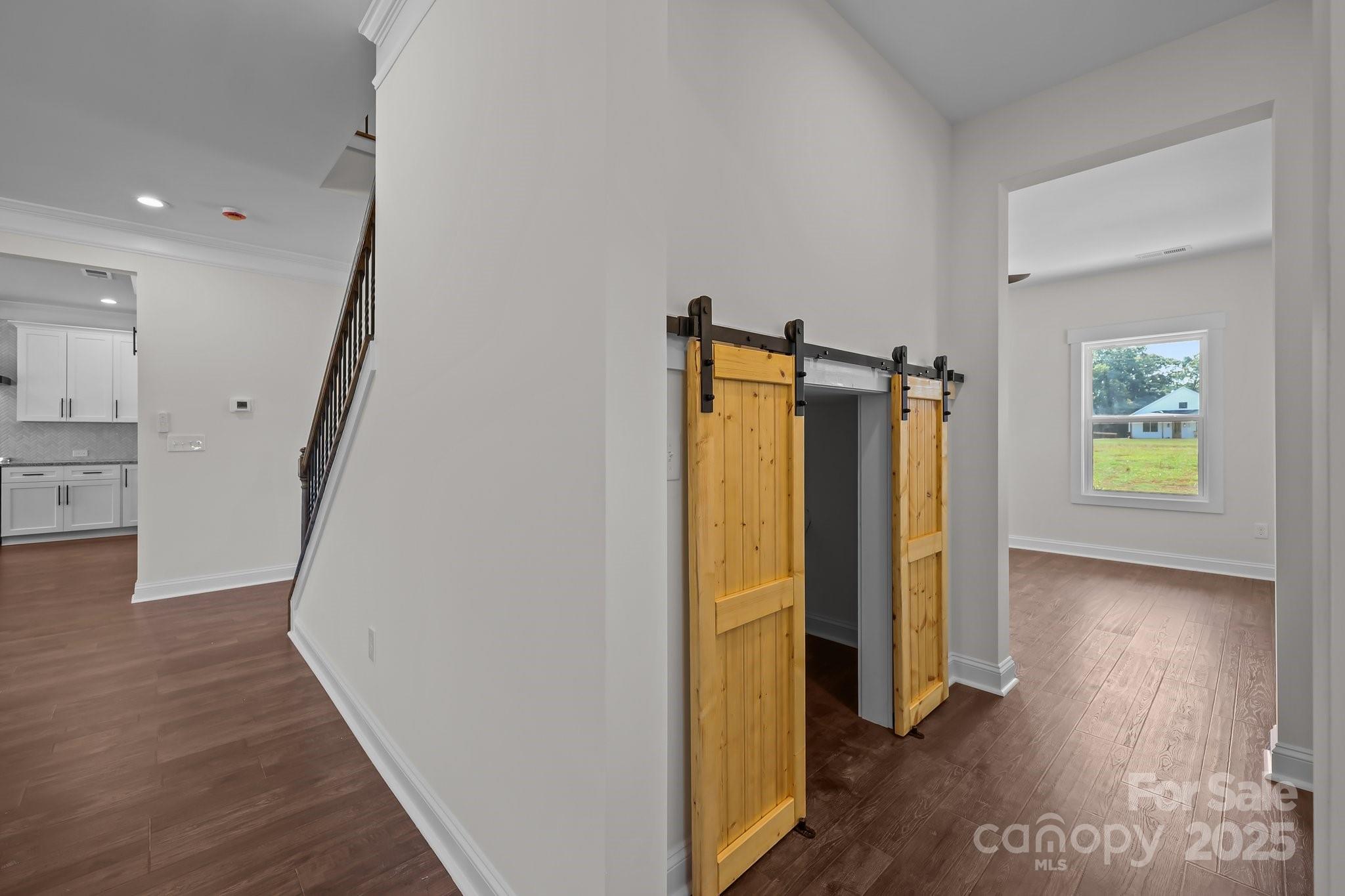 4040 Daugherty Road China Grove, NC 28023 - Photo 31 of 45 a view of a hallway with wooden floor and closet