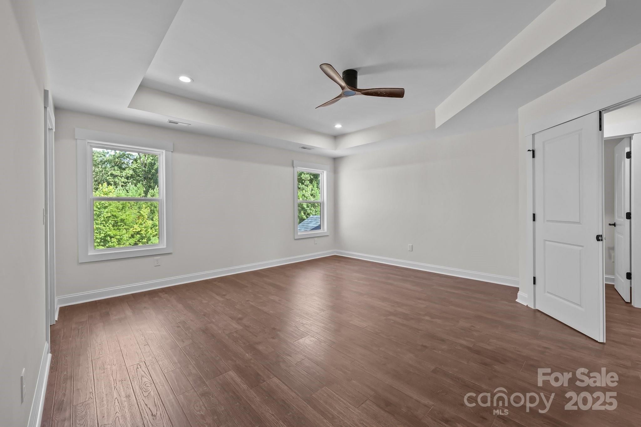 4040 Daugherty Road China Grove, NC 28023 - Photo 35 of 45 an empty room with wooden floor and windows
