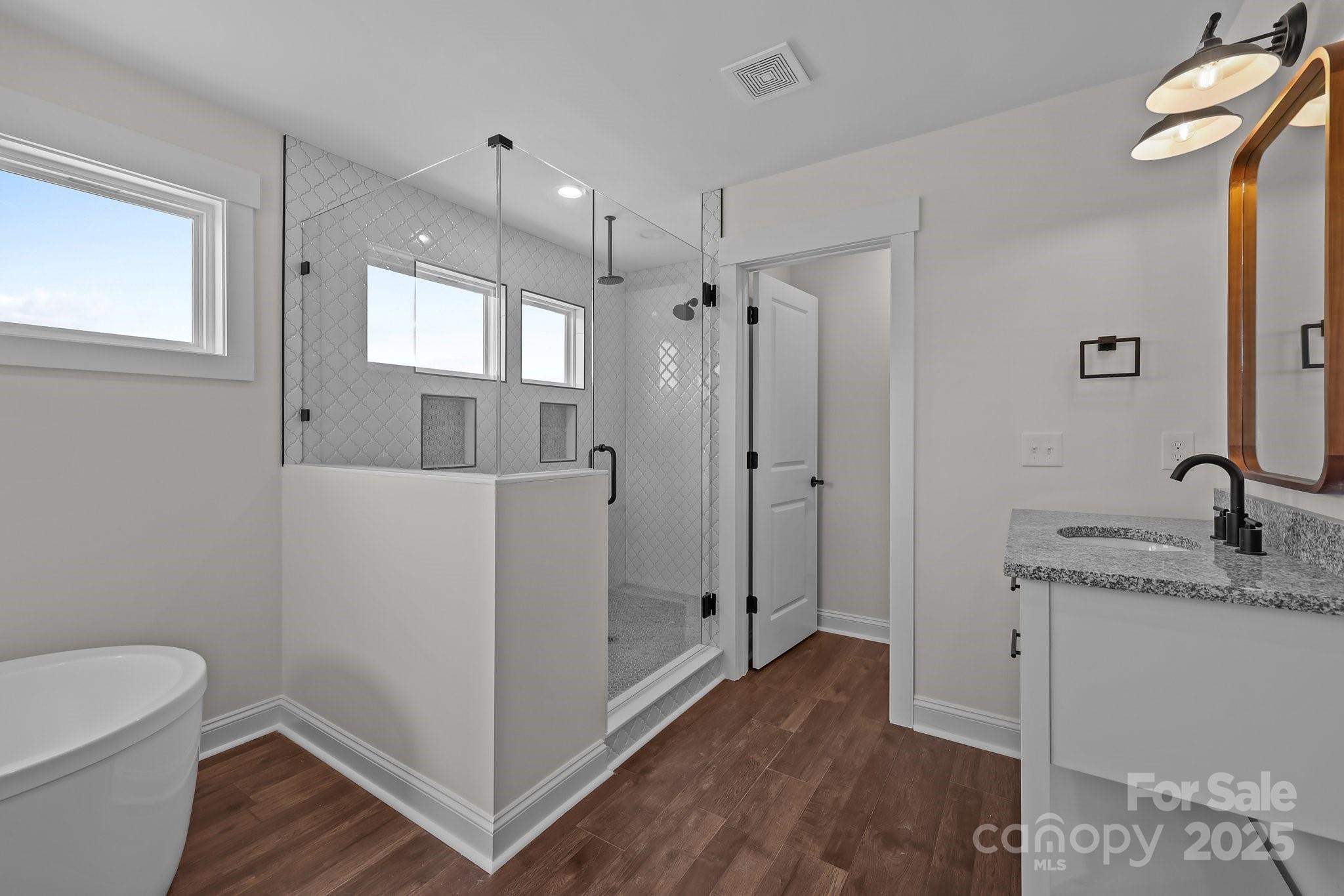 4040 Daugherty Road China Grove, NC 28023 - Photo 38 of 45 a bathroom with a granite countertop sink toilet and shower