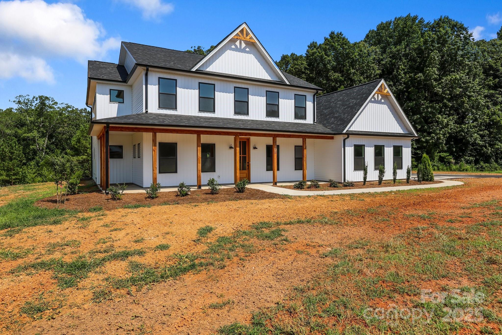 4040 Daugherty Road China Grove, NC 28023 - Photo 9 of 45 a front view of a house with a yard