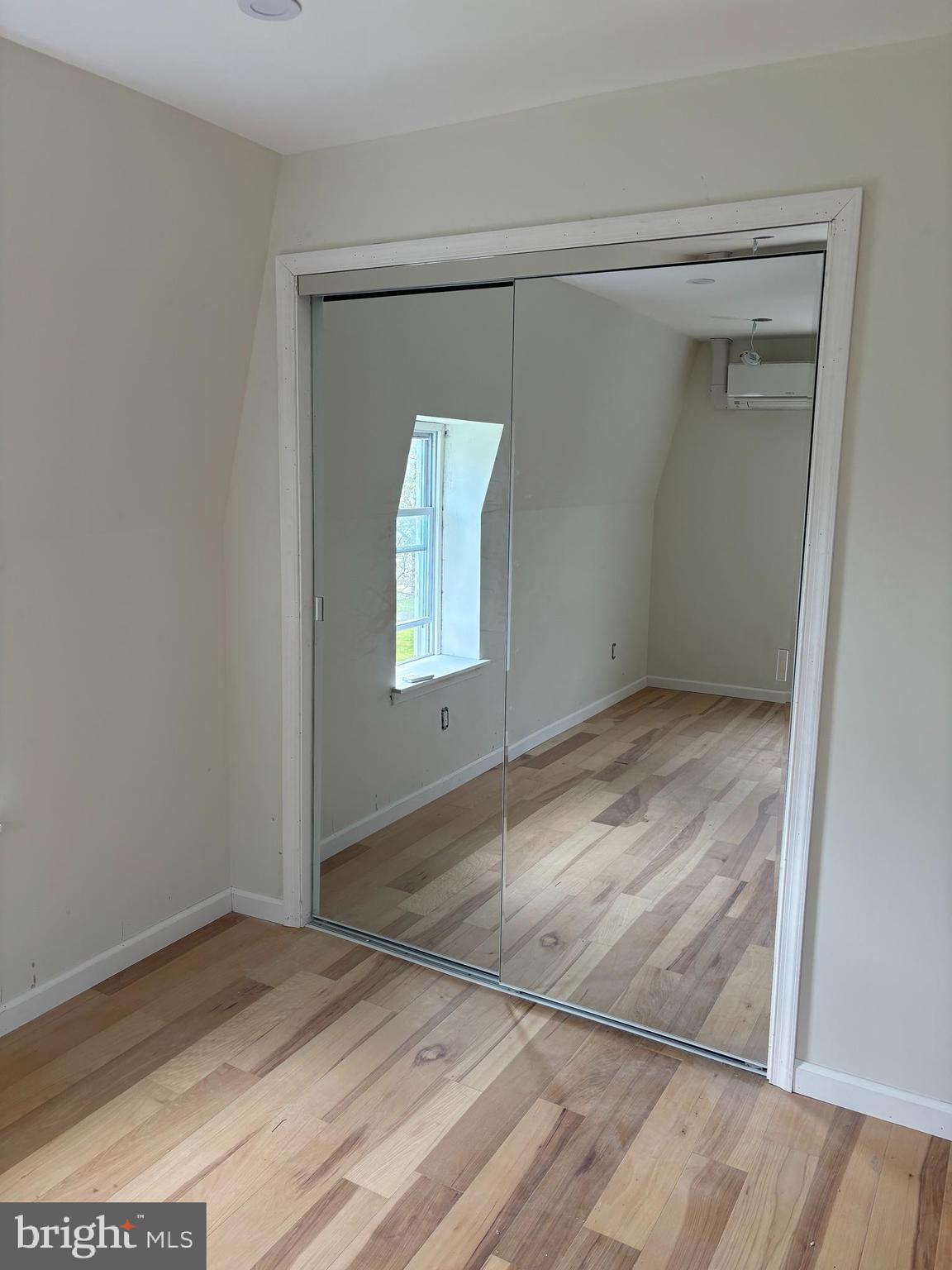 7501 Church Hill Road, Unit 5 Chestertown, MD 21620 - Photo 12 of 17 an empty room with wooden floor and closet