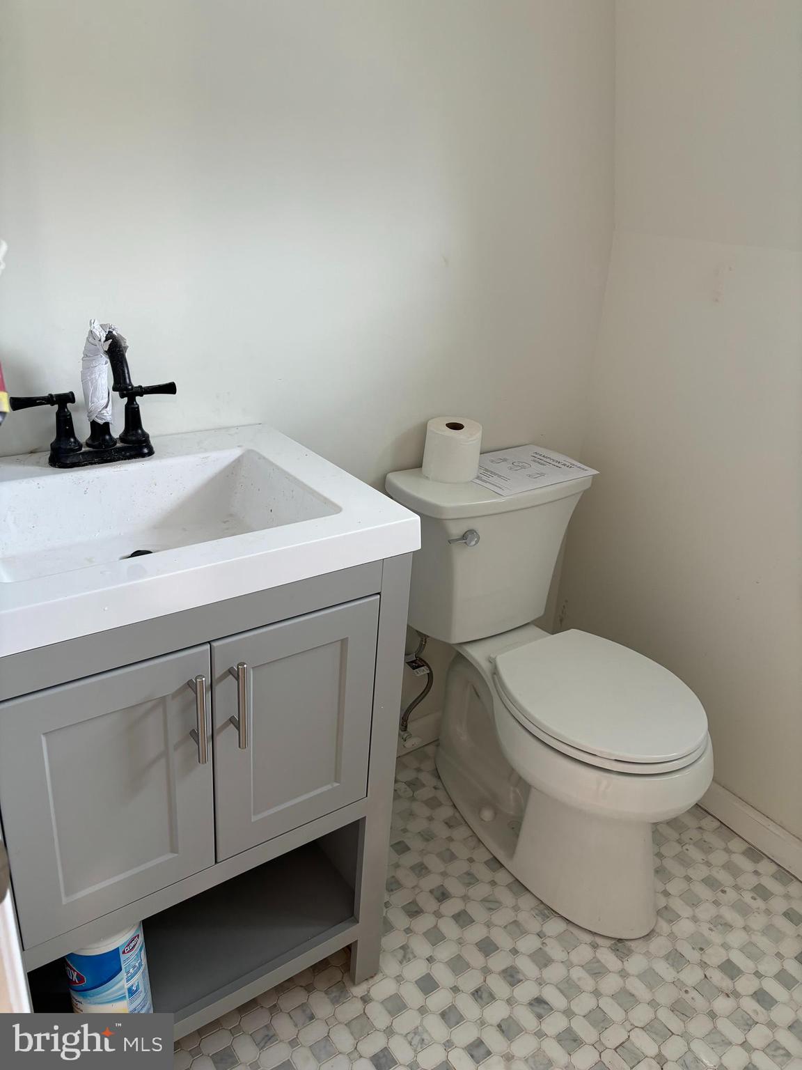 7501 Church Hill Road, Unit 5 Chestertown, MD 21620 - Photo 13 of 17 a bathroom with a toilet sink and mirror