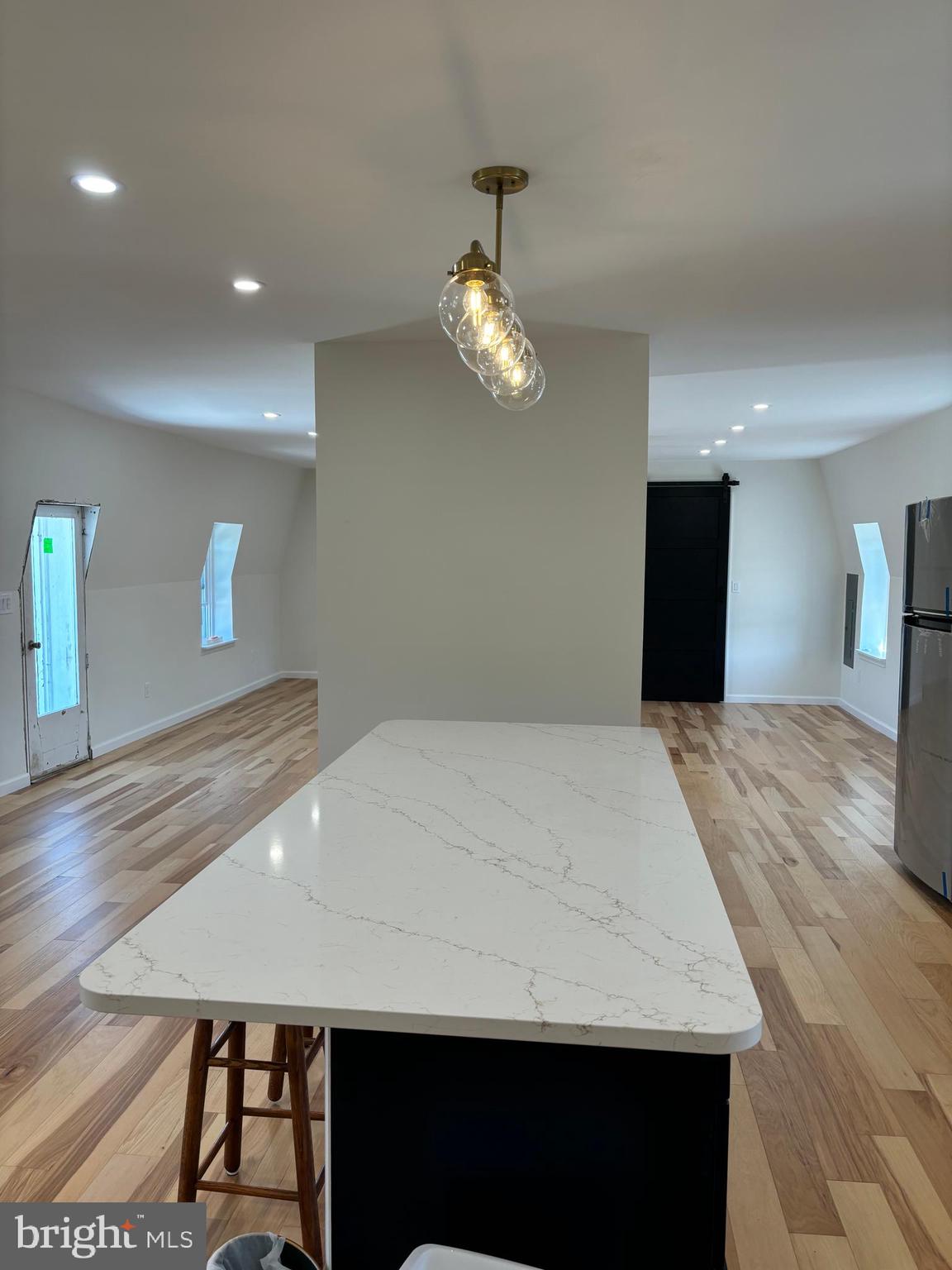 7501 Church Hill Road, Unit 5 Chestertown, MD 21620 - Photo 10 of 17 a view of a room with a chandelier wooden floor and a chandelier