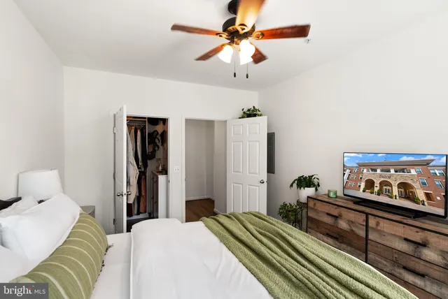 a bedroom with a bed and a view of bedroom